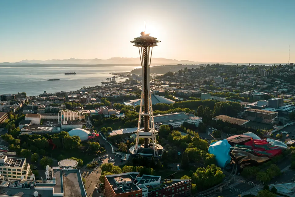 The Space Needle and Seattle skyline with Mount Rainier in the distance